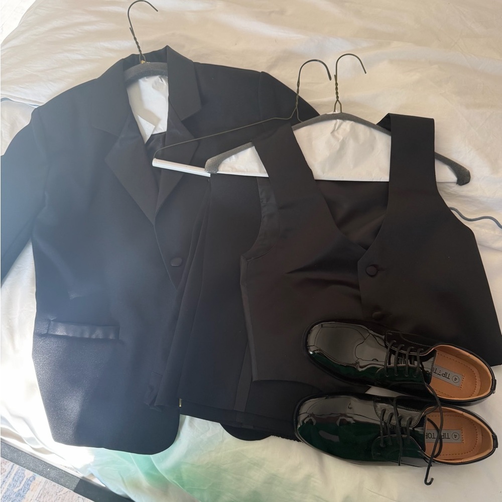 Boys 3 piece tuxedo (size 8) and size 4 tuxedo shoes. Worn once and dry cleaned.
